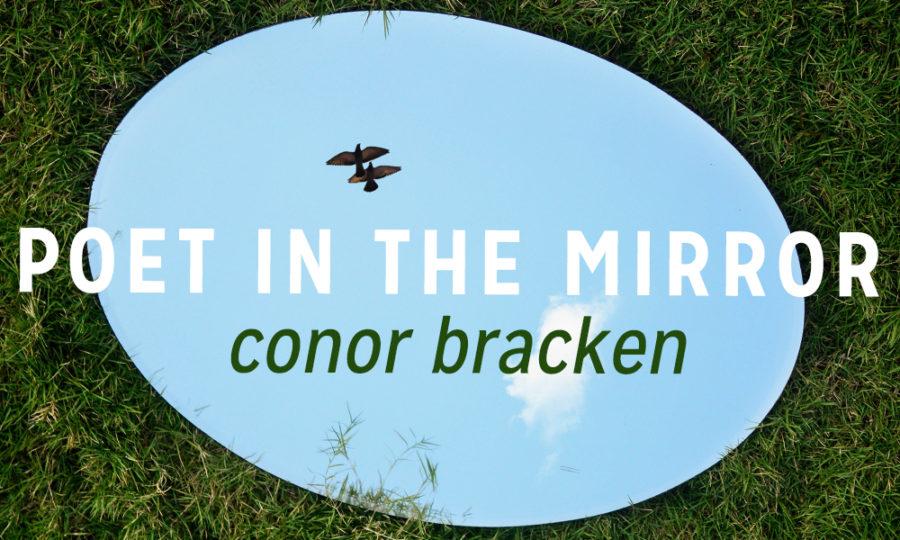 picture of a mirror on grass with bird in reflection. Text reads Poet in the Mirror Conor Bracken